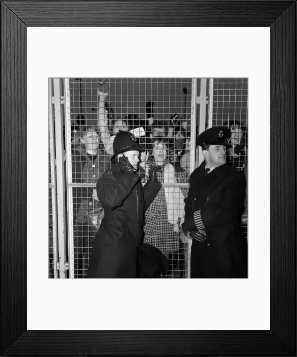 Framed Print : Excited female Beatles fans deafen a young policeman keeping them at bay before Framed Print : Excited female Beatles fans deafen a young policeman keeping them at bay before