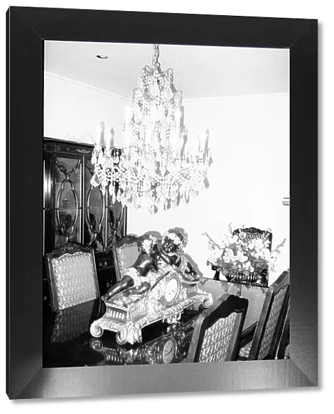 The dining room with its chandelier and ornamental clock September 1983