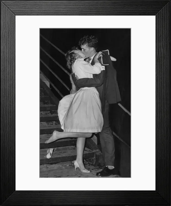 Framed Print : A young couple kissing on the sea front at Blackpool Framed Print : A young couple kissing on the sea front at Blackpool