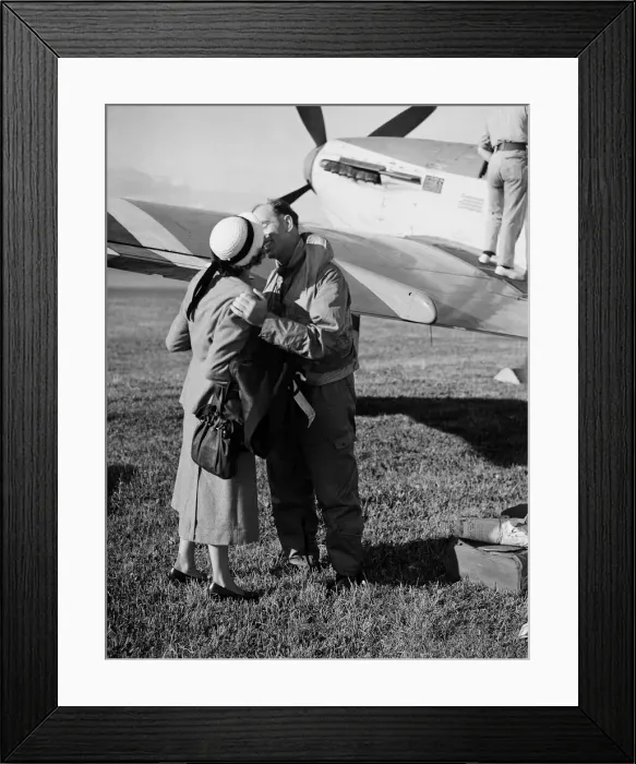 Framed Print : Fleet Air Arm Pilots return from Korean War - A pilot is greeted by his wife with a kiss Framed Print : Fleet Air Arm Pilots return from Korean War - A pilot is greeted by his wife with a kiss
