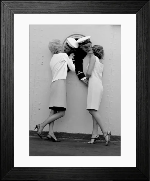 Framed Print : Sub. Lieutenant John Blake and leading seaman Niniam Howells share a port hole to greet Framed Print : Sub. Lieutenant John Blake and leading seaman Niniam Howells share a port hole to greet