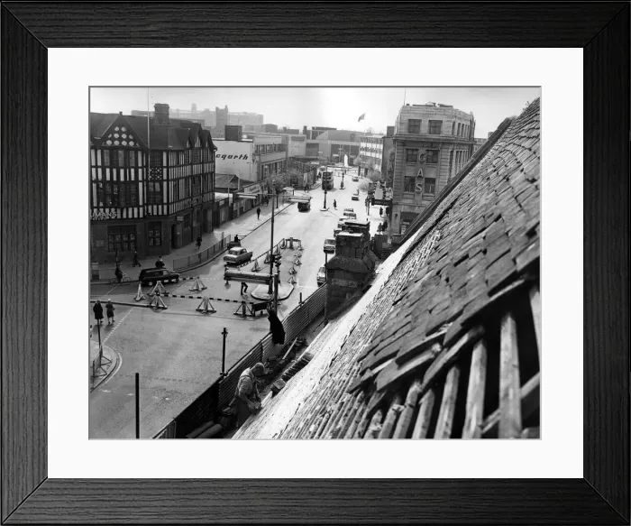 Framed Print : This unusual view of Corporation Street, Coventry, is taken as workmen repair the roof of Framed Print : This unusual view of Corporation Street, Coventry, is taken as workmen repair the roof of