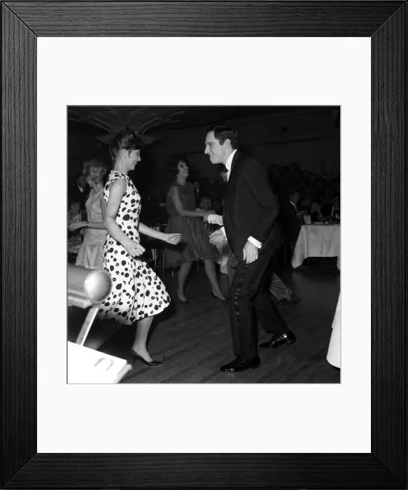 Framed Print : Dances The Twist. Anthony Newley and Alma Cogan in the background dancing at The Hungaria Framed Print : Dances The Twist. Anthony Newley and Alma Cogan in the background dancing at The Hungaria