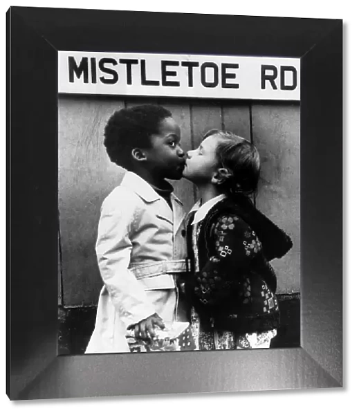 Children Kissing under the Mistletoe Rd sign. Mistletoe Road Circa 1973