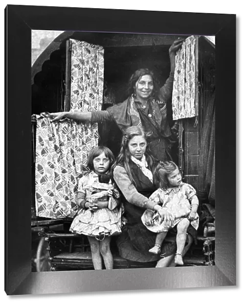 A typical gypsy family at the door of their caravan at the 700 year old fair at Yarm