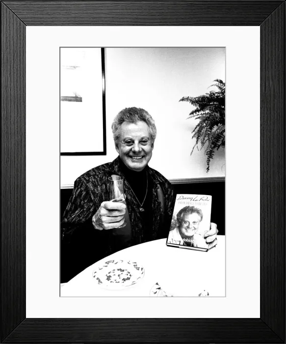 Framed Print : Entertainer Danny La Rue at a Newcastle restaurant signing copies of his autobiography Framed Print : Entertainer Danny La Rue at a Newcastle restaurant signing copies of his autobiography