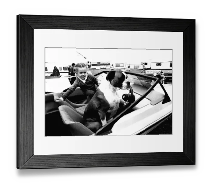 Framed Print : A young girl and her dog try out a speedboat at the Whitley Bay Motor Show. 18 / 07 / 80 Framed Print : A young girl and her dog try out a speedboat at the Whitley Bay Motor Show. 18 / 07 / 80