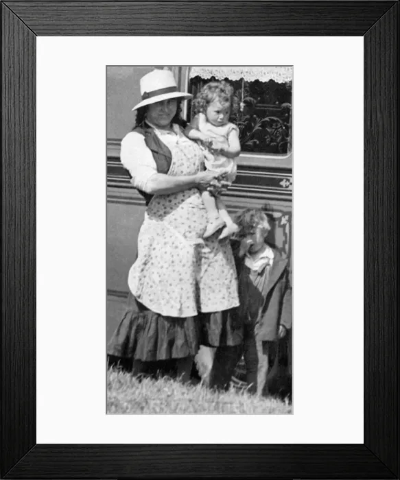 Framed Print : A gypsy family posing in front of their home in June 1934 Framed Print : A gypsy family posing in front of their home in June 1934