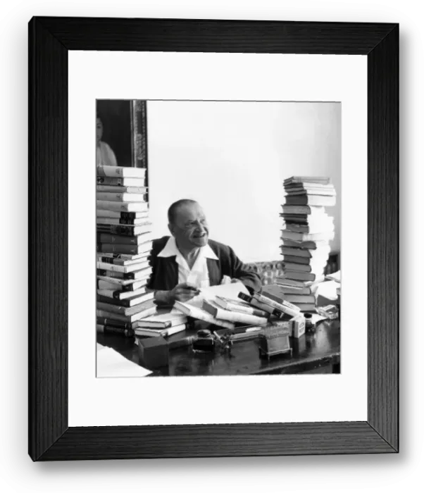 Framed Print : Somerset Maugham at Villa Mauresque, Cap Ferrat. Seen here sitting in his Framed Print : Somerset Maugham at Villa Mauresque, Cap Ferrat. Seen here sitting in his