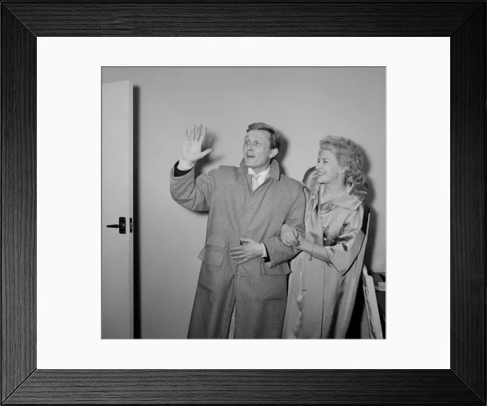 Framed Print : British singer and actor Gary Miller with his wife Joy wave goodbye to their children as Framed Print : British singer and actor Gary Miller with his wife Joy wave goodbye to their children as