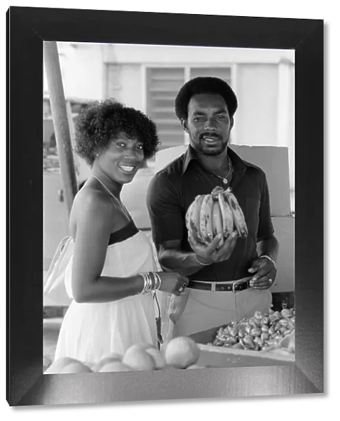 England in West Indies 1981. Roland Butcher out shopping at a fruit & veg stall