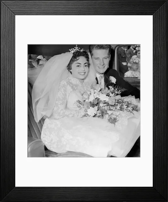 Framed Print : Pamela and David Moore seen here in the car on their way to the their reception in West