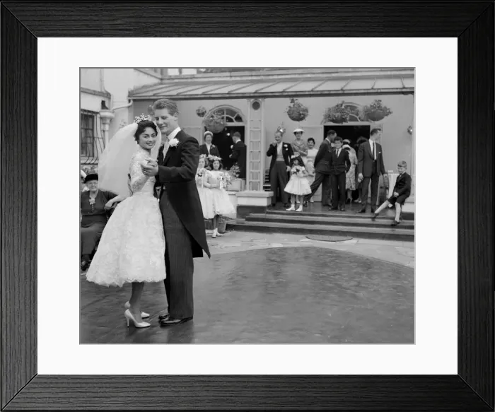 Framed Print : Pamela and David Moore lead the first dance in the rose garden at their reception Framed Print : Pamela and David Moore lead the first dance in the rose garden at their reception