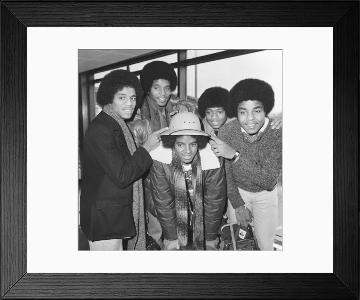 Framed Print : Members of The Jackson Five pop group make their way through the arrivals hall as they Framed Print : Members of The Jackson Five pop group make their way through the arrivals hall as they