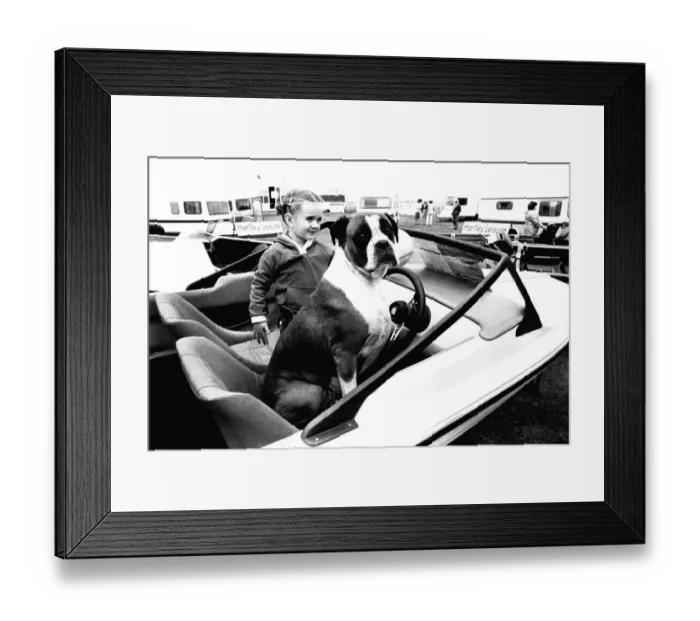 Framed Print : A young girl and her dog try out a speedboat at the Whitley Bay Motor Show. 18 / 07 / 80 Framed Print : A young girl and her dog try out a speedboat at the Whitley Bay Motor Show. 18 / 07 / 80