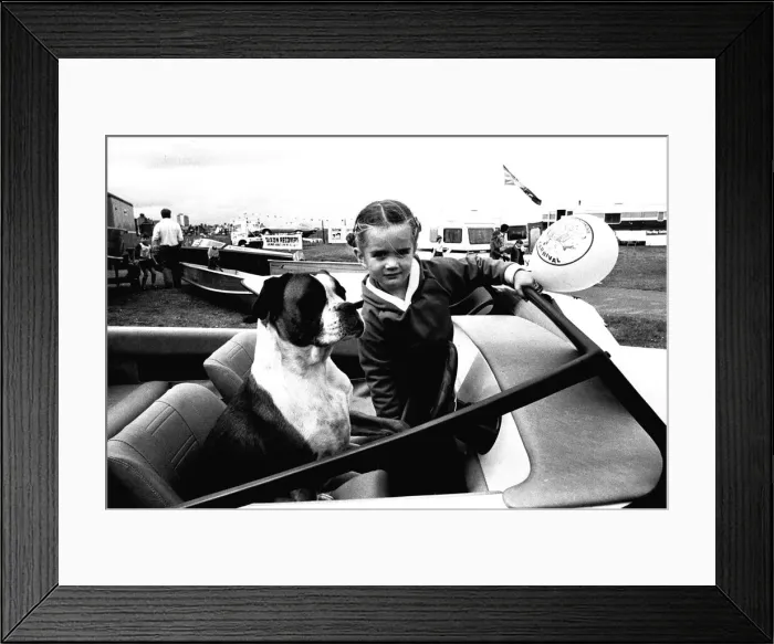 Framed Print : A young girl and her dog try out a speedboat at the Whitley Bay Motor Show. 18 / 07 / 80 Framed Print : A young girl and her dog try out a speedboat at the Whitley Bay Motor Show. 18 / 07 / 80