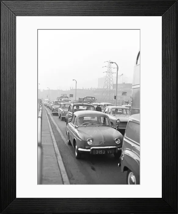 Framed Print : Traffic in Dagenham as the Ford factory turns out at the end of the day shift Framed Print : Traffic in Dagenham as the Ford factory turns out at the end of the day shift