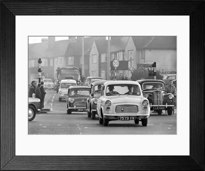 Framed Print : Traffic in High Street Dagenham as the Ford factory turns out at the end of the day shift Framed Print : Traffic in High Street Dagenham as the Ford factory turns out at the end of the day shift