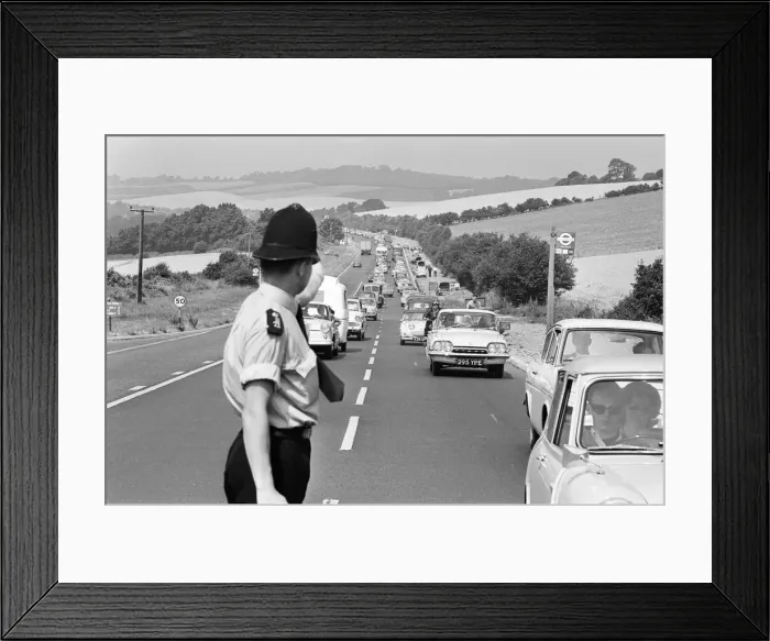Framed Print : Policeman directing August Bank Holiday taffic on the A20