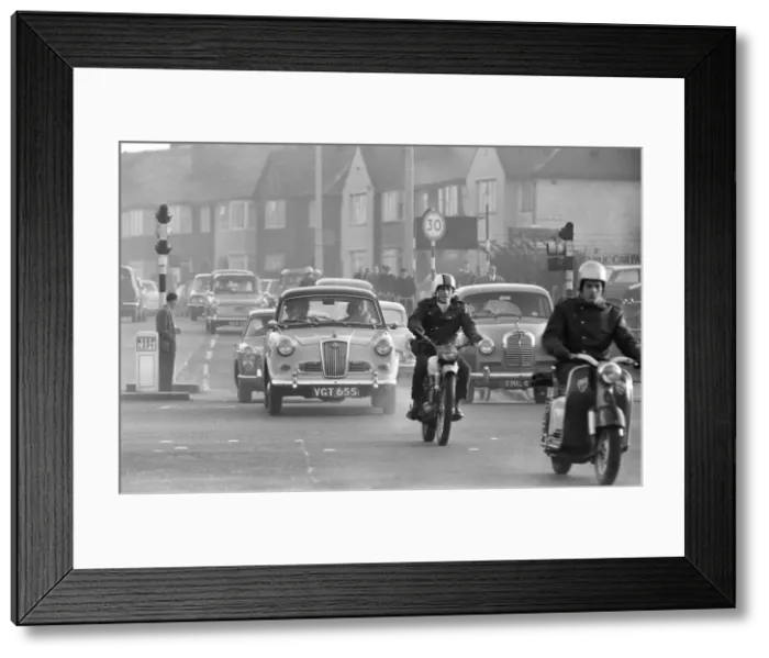 Framed Print : Traffic in High Street Dagenham as the Ford factory turns out at the end of the day shift Framed Print : Traffic in High Street Dagenham as the Ford factory turns out at the end of the day shift