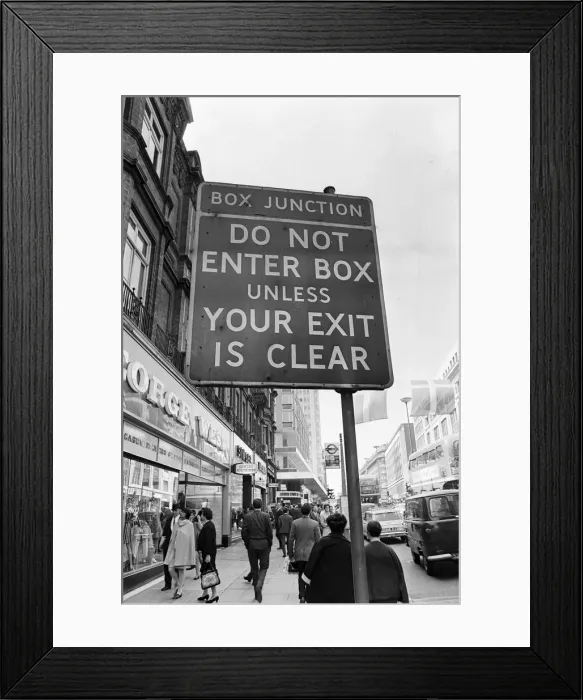 Framed Print : Sign warning drivers of a box junction ahead in rin Oxford Street London
