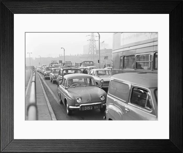 Framed Print : Traffic in Dagenham as the Ford factory turns out at the end of the day shift Framed Print : Traffic in Dagenham as the Ford factory turns out at the end of the day shift