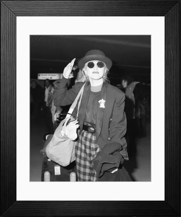 Framed Print : Cyndi Lauper american singer songwriter pictured with manager David Wolff arriving