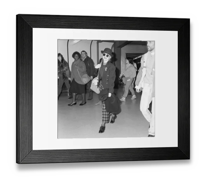 Framed Print : Cyndi Lauper american singer songwriter pictured with manager David Wolff arriving