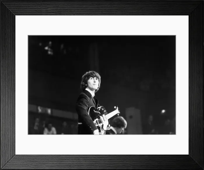 Framed Print : George Harrison of The Beatles on stage at the Palais des Sport in Paris. June 1965 Framed Print : George Harrison of The Beatles on stage at the Palais des Sport in Paris. June 1965