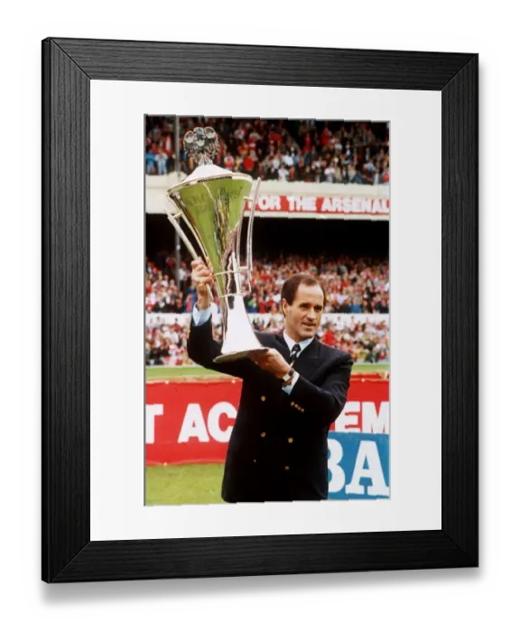 Framed Print : Arsenal manager George Graham holding lthew Manager of the Year Award aloft at Highbury