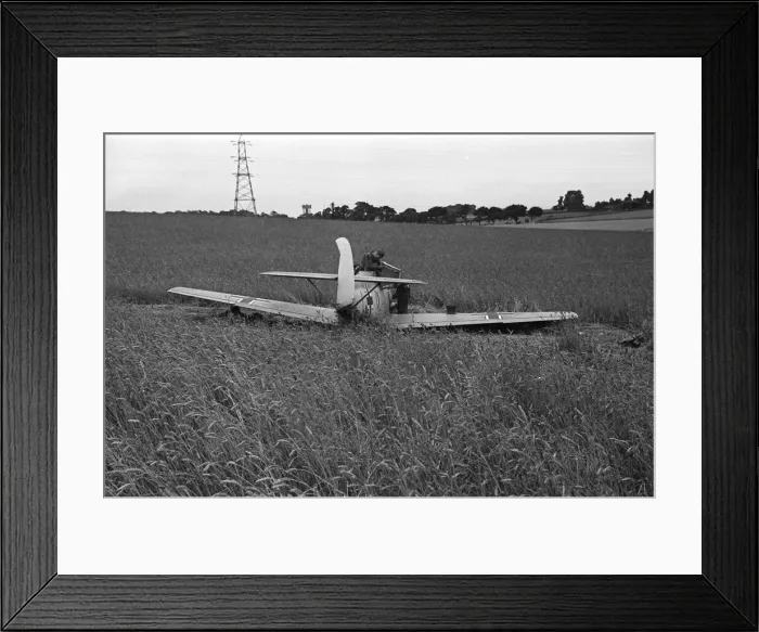 Framed Print : Members of the RAF technical team examine a downed Messerschmitt BF109 during the Battle Framed Print : Members of the RAF technical team examine a downed Messerschmitt BF109 during the Battle