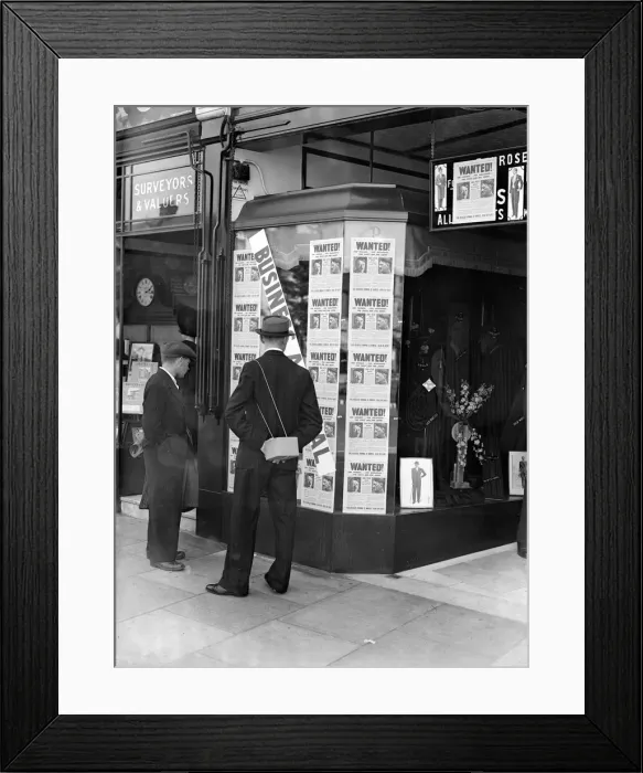 Framed Print : A passer-by look at a tailor shop window plastered with copies of the Daily Mirror Hitler Framed Print : A passer-by look at a tailor shop window plastered with copies of the Daily Mirror Hitler