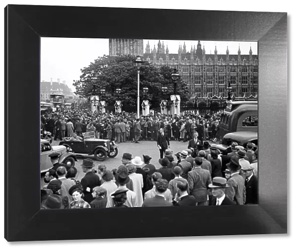 Large crowds gather outside the Houses of Parliment for news following Germany
