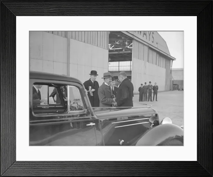 Framed Print : British Prime Minister Neville Chamberlain shakes hands with a German embassy official Framed Print : British Prime Minister Neville Chamberlain shakes hands with a German embassy official