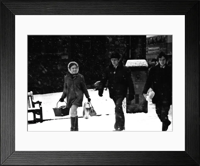 Framed Print : Traffic and pedestrains struggle against the snow on Grainger Street