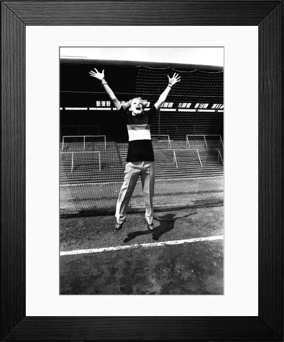 Framed Print : Reporter Claire models clothes for sale from footballer Malcolm MacDonald