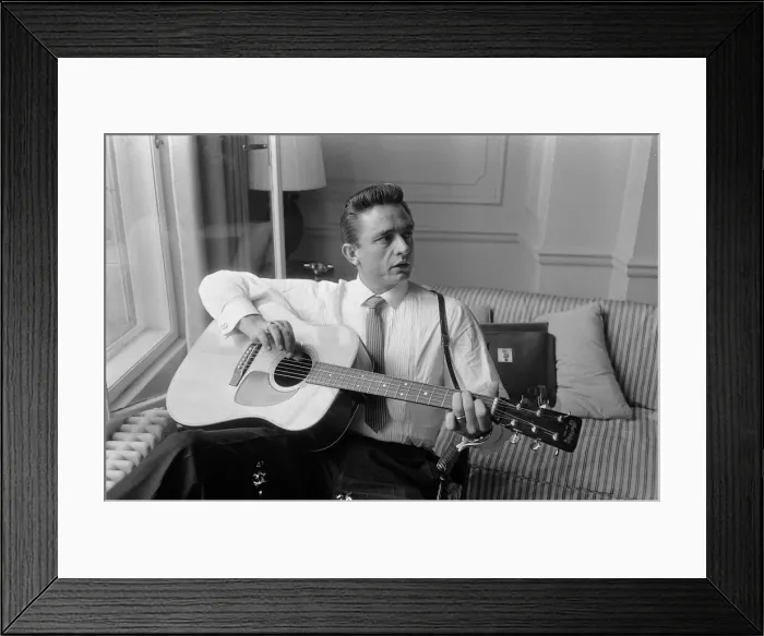 Framed Print : American country singer and musician Johnny Cash poses for photographers at the Savoy
