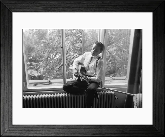 Framed Print : American country singer and musician Johnny Cash poses for photographers at the Savoy
