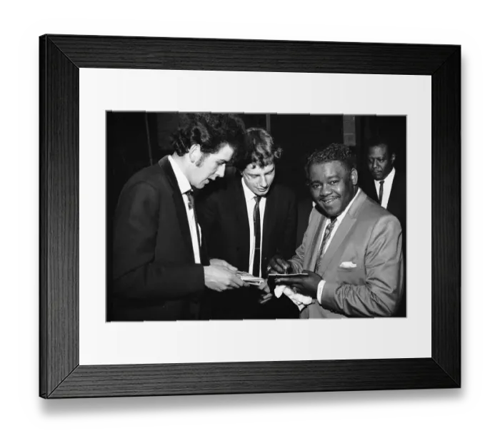 Framed Print : American rock and roll star Fats Domino signs autographs for fans on the stage of Framed Print : American rock and roll star Fats Domino signs autographs for fans on the stage of