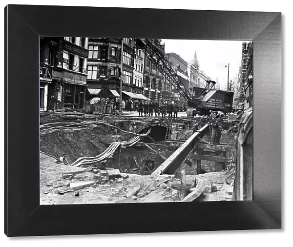 Bomb damage being repaired on The Charing Cross Road, near Manette St, London