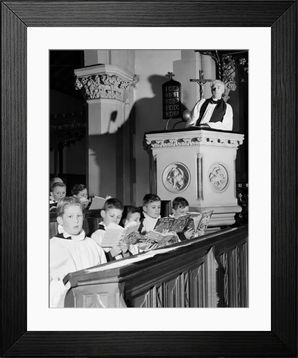 Framed Print : Choirboys reading their books in church during a priests sermon Circa 1954 Framed Print : Choirboys reading their books in church during a priests sermon Circa 1954