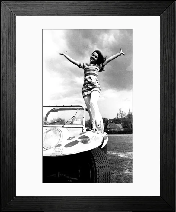 Framed Print : A model in a beach buggy wearing a dress in April 1970 Framed Print : A model in a beach buggy wearing a dress in April 1970