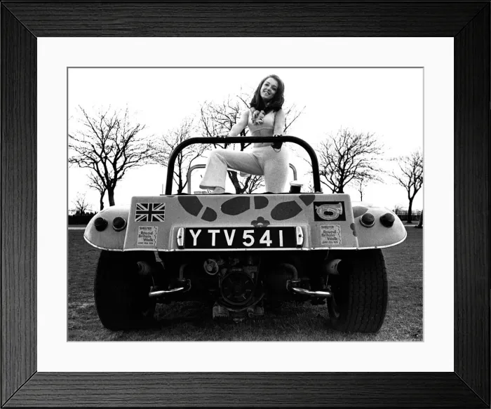 Framed Print : A model in a beach buggy wearing a trouser suit in April 1970