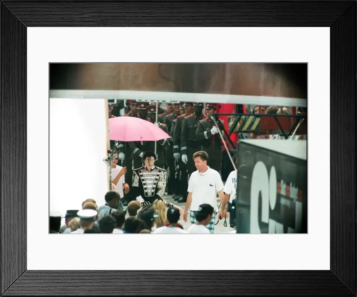 Framed Print : American pop singer Michael Jackson with his entourage on a walkabout in Budapest Framed Print : American pop singer Michael Jackson with his entourage on a walkabout in Budapest