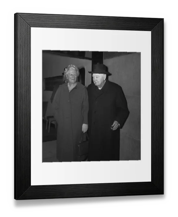 Framed Print : Sir Winston Churchill with his wife Lady Churchill leaving a side entrance of the Savoy