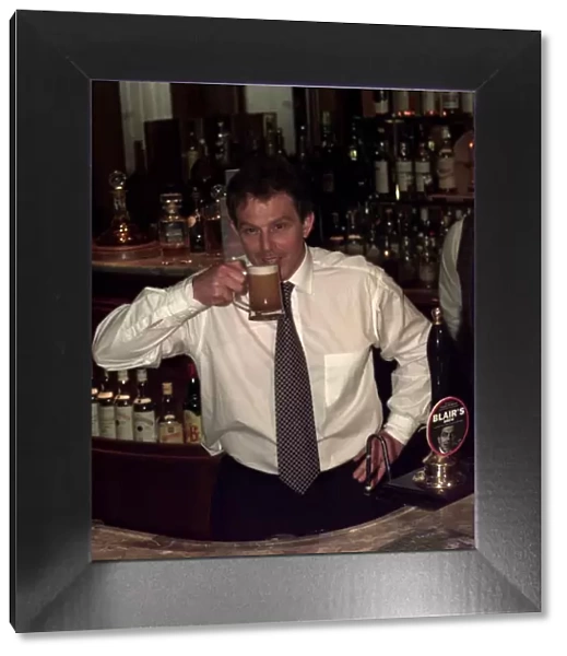 Tony Blair about to drink Blairs Brew Special beer, April 1997