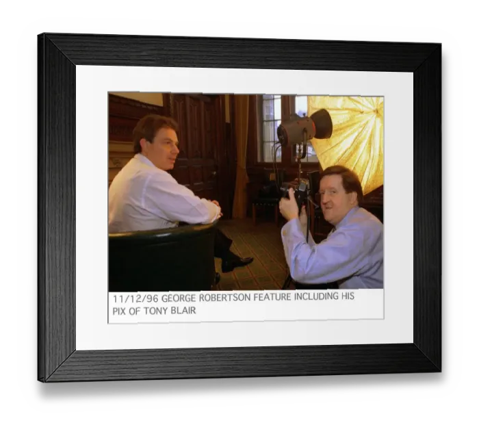 Framed Print : George Robertson MP feature including his picture of Tony Blair sitting in green chair