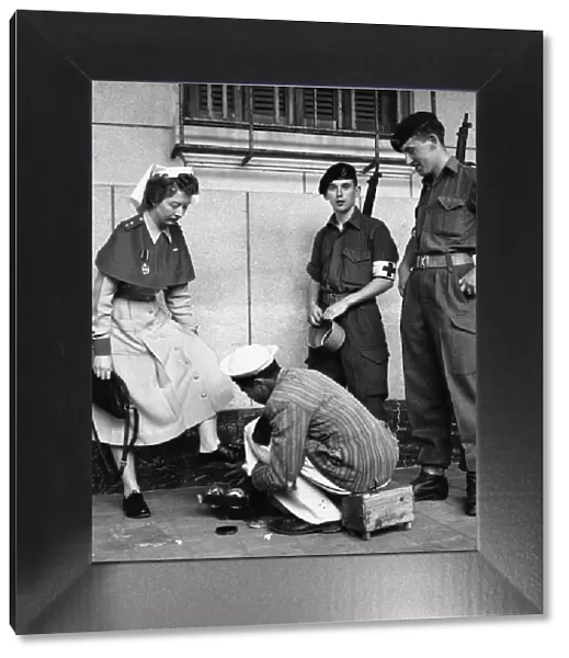 Suez Crisis 1956 British Army nurse Jean Leich has her shoes shined in Port
