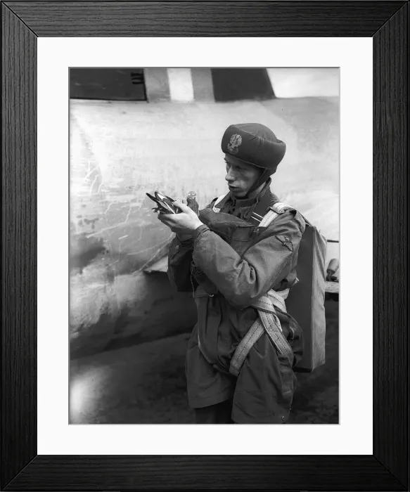 Framed Print : A soldier during WW2 holding a homing pigeon