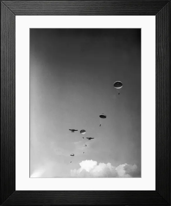 Framed Print : Paratroopers descending from planes during WW2. Circa 1942 Framed Print : Paratroopers descending from planes during WW2. Circa 1942